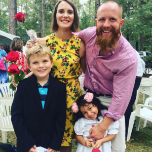 Host Colin MacIver with his wife and children